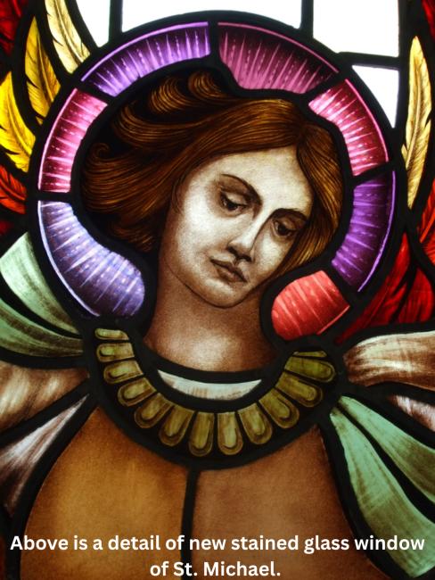 Above is a detail of new stained glass window of St Michael 